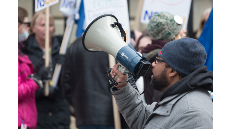 NSGEU Striking Nurse with Megaphone