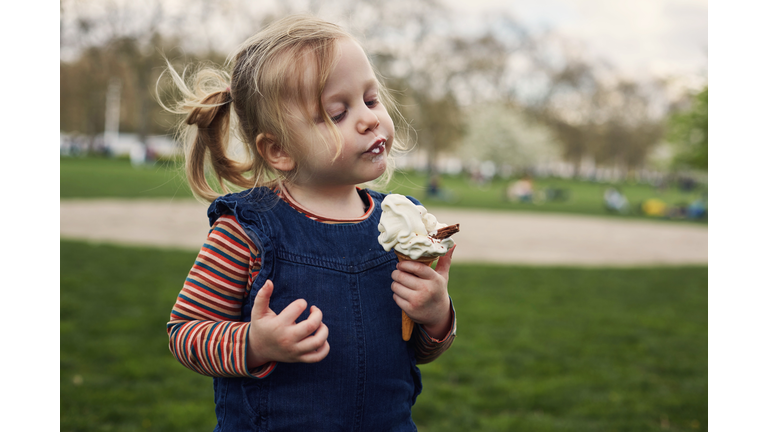 Child enjoying eating an ice cream