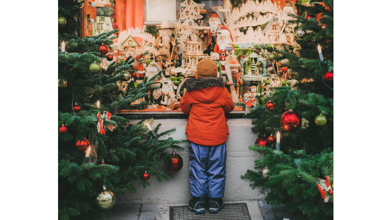 Little boy  standing near Christmas tree in Rothenburg