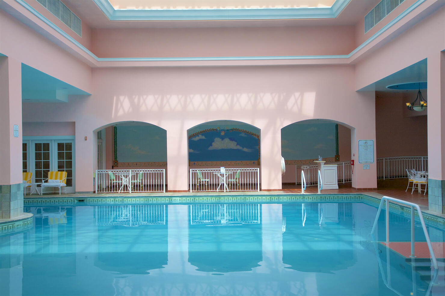 Reflections in water at indoor pool at luxury resort, Colorado Springs