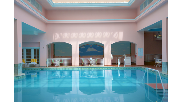 Reflections in water at indoor pool at luxury resort, Colorado Springs