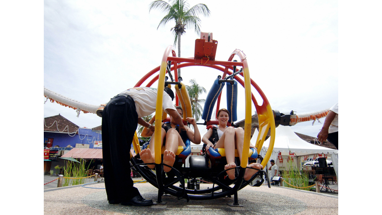 An employee of a park examines the safet