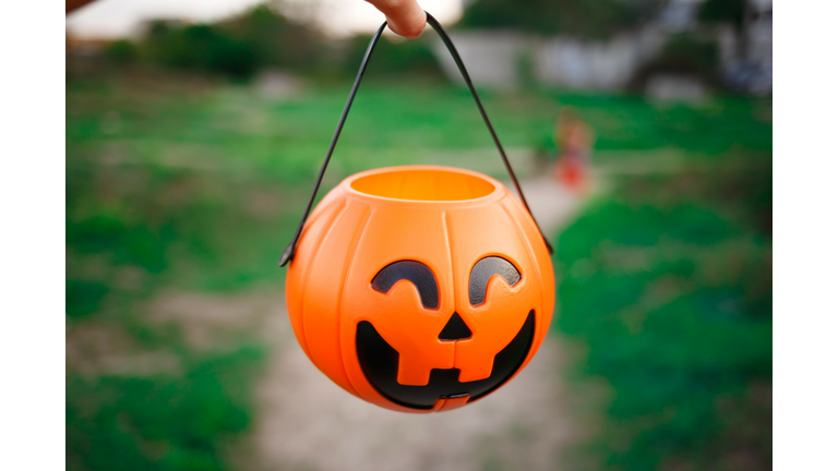 a basket for halloween sweets in the form of a pumpkin