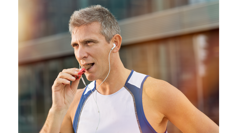 Fitness Man Eating Snack Food