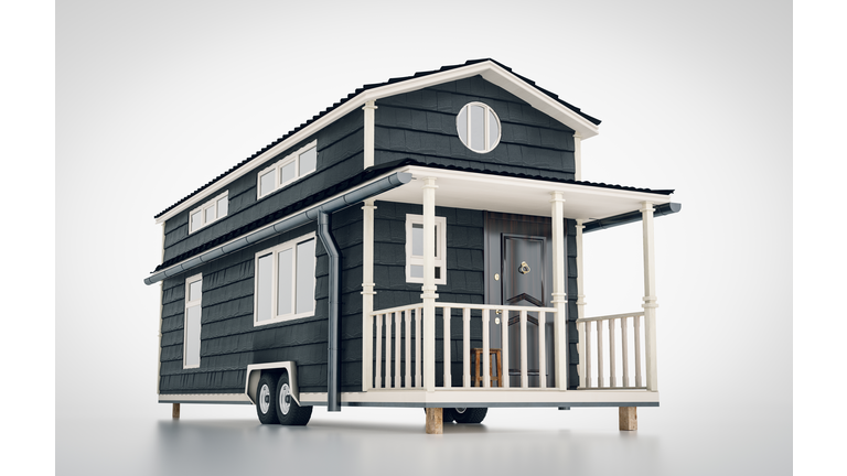 Concept of a mobile scandinavian tiny house isolated on white background. 3d rendering.