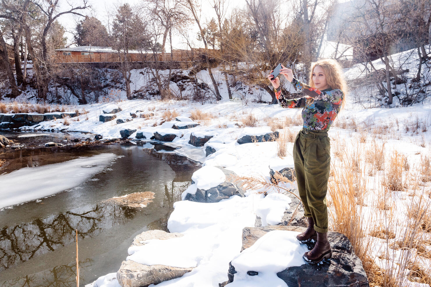 Millennial Teenager Taking Photos in Snowy Colorado Park