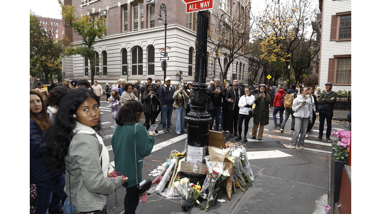 Fans Pay Tribute To Late Actor Matthew Perry Outside "Friends" Building In New York City