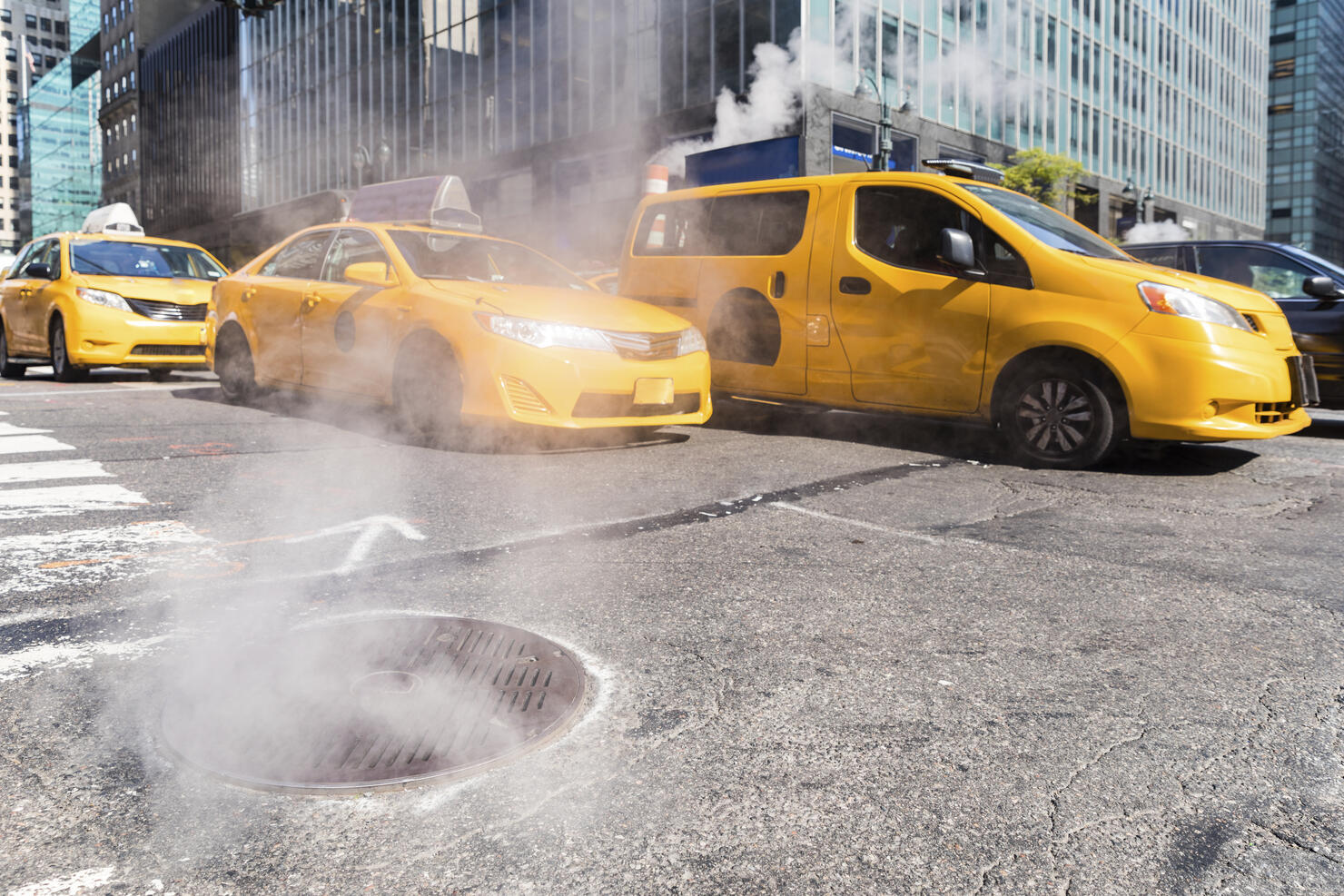 USA, New York, steam coming out from sewer