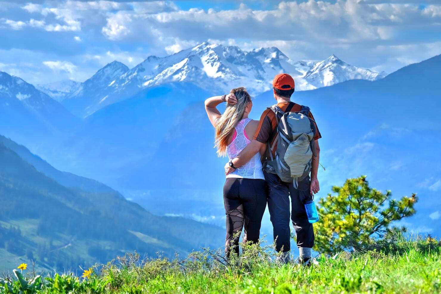 Happy friends hipsters  hiking in mountains.