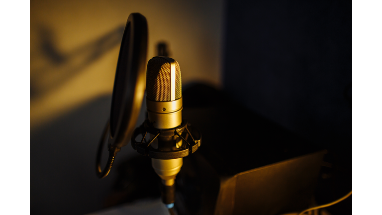 Interior of home recording studio with microphone close-up. Podcast streaming at home. Blogger concept.