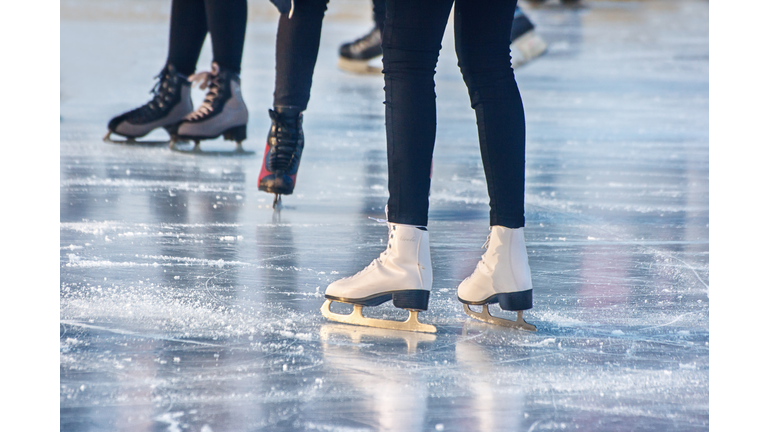 legs of people skating closeup