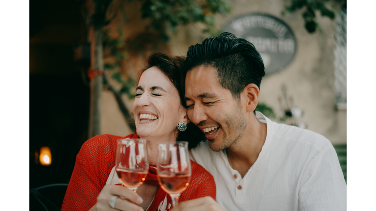 Couple enjoying wine in Italy