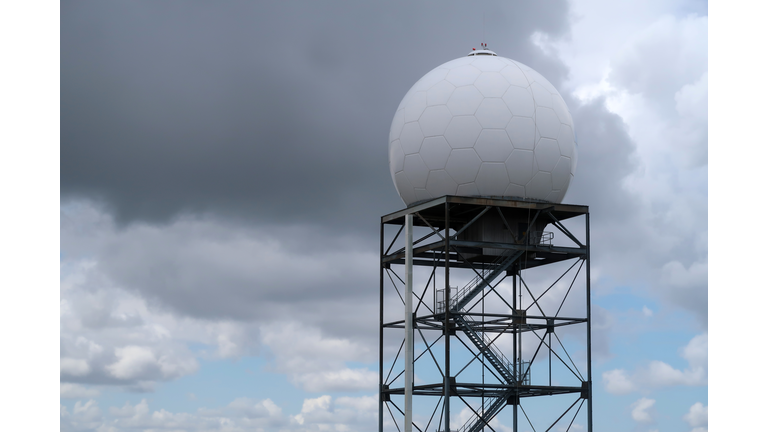 Weather Radar Tower against Partly Cloudy Sky