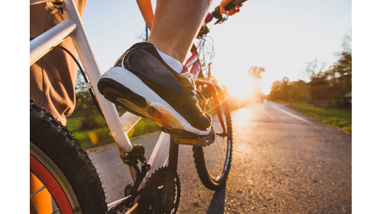 cycling sport, feet on pedal of bike