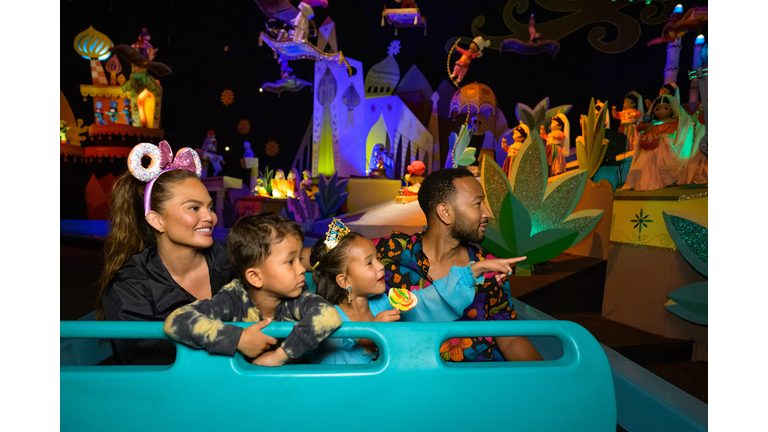 Chrissy Teigen And John Legend Visit Disneyland Resort in Anaheim, California