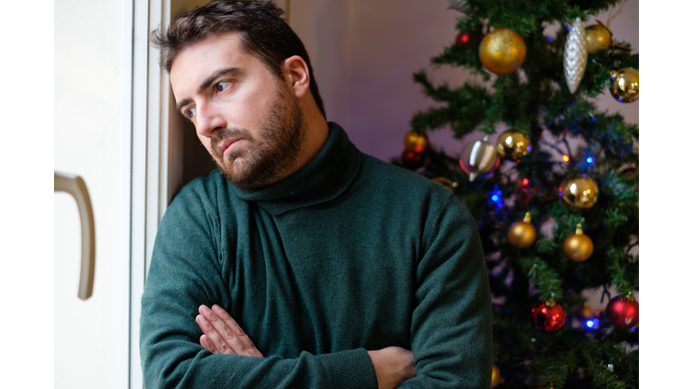 Man in solitude feeling bad during christmas day