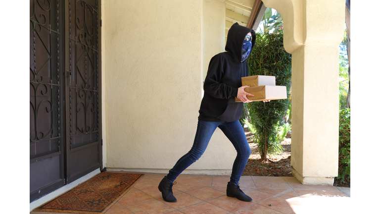Porch Pirate Person in Glasses Steals Boxes Horizontal