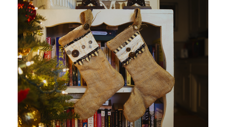 Stockings hanging on bookcase