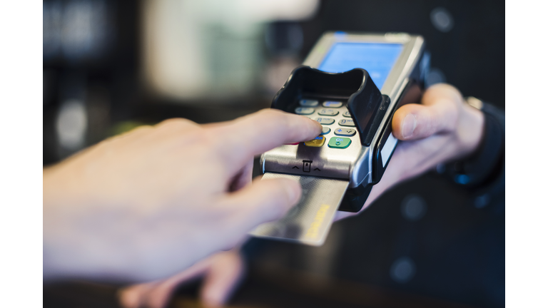 Man using credit card reader, close-up