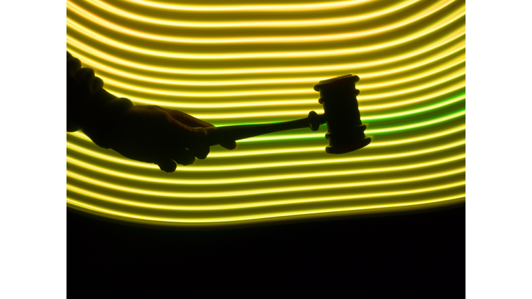 Judge's hammer in a futuristic yellow environment