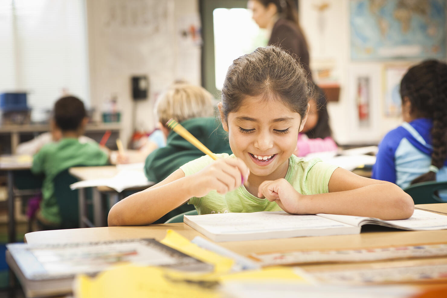 Hispanic student working in class