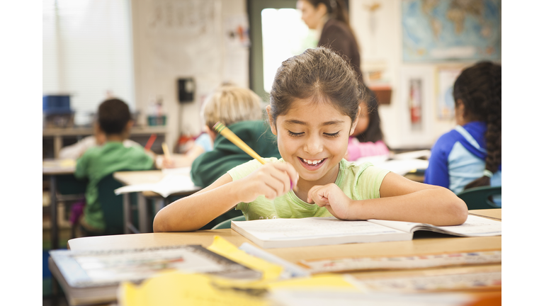 Hispanic student working in class