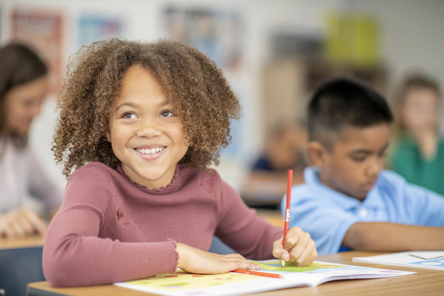 Elementary Student Writing in Class