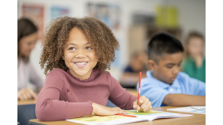 Elementary Student Writing in Class