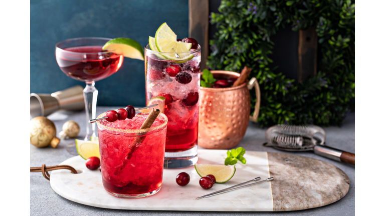 Variety of festive Christmas cocktails with cranberry and lime