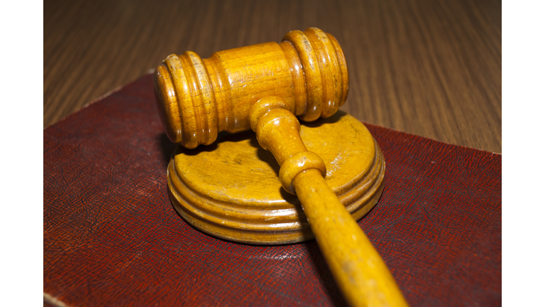 judge's gavel and very old legal book in Guatemala.