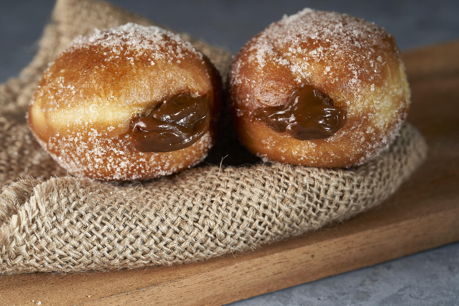 Berliners (berlin balls) stuffed with dulce de leche with sugar on top