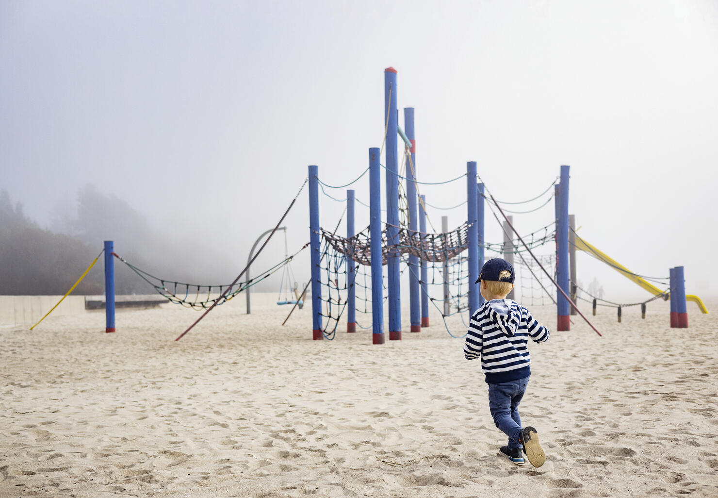 Little boy at empty playground