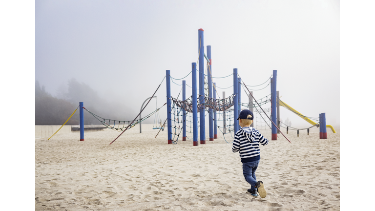 Little boy at empty playground