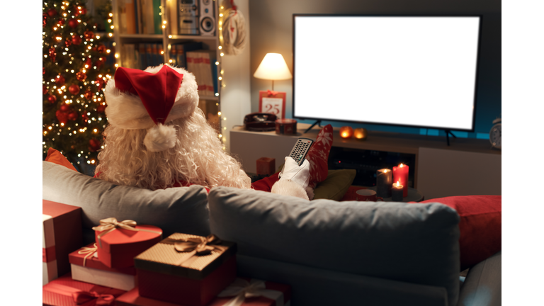 Santa Claus watching television at home