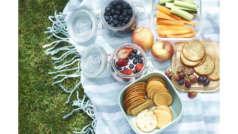 Homemade picnic with organic foods in reusable plastic free containers.