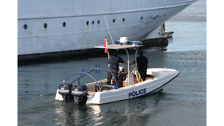 Police boat with two officers patrolling the harbour