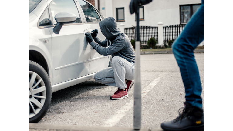 Men stealing a car