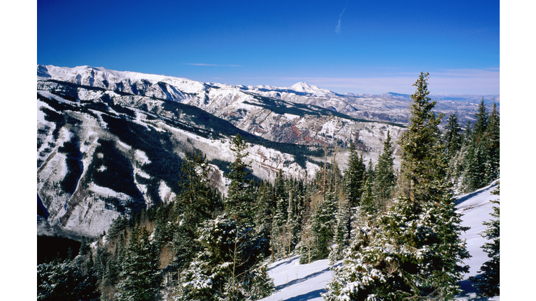 Snow-covered mountains from Aspen Mountain.