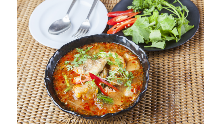 spicy thai cuisine with red curry and herb