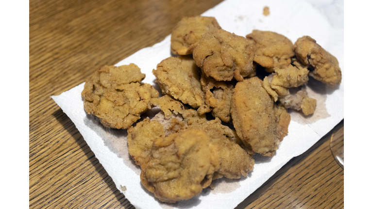 Frayed Bulls Testicles on a Table - Rocky Mountain Oysters Special plate