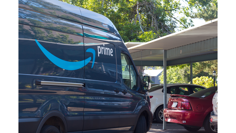 Amazon Prime delivery van in residential parking lot