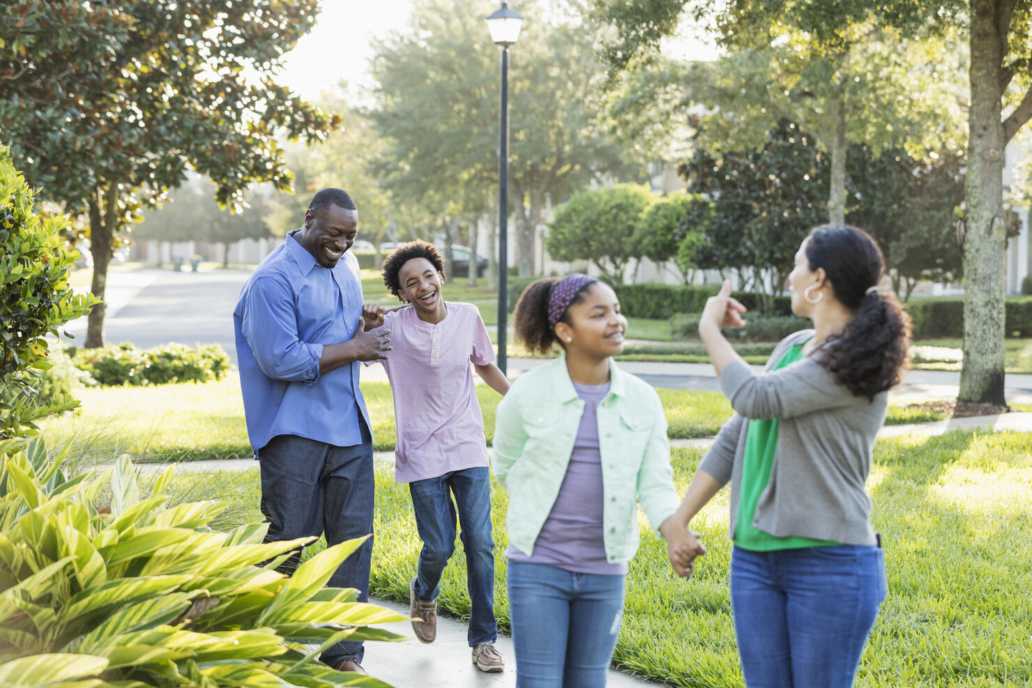 Interracial family, two children, taking walk together