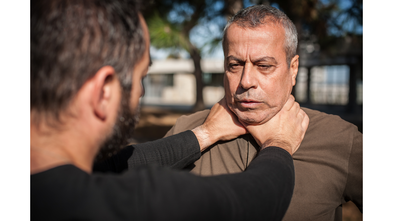 Two men quarrel and fight. Two thugs are fighting