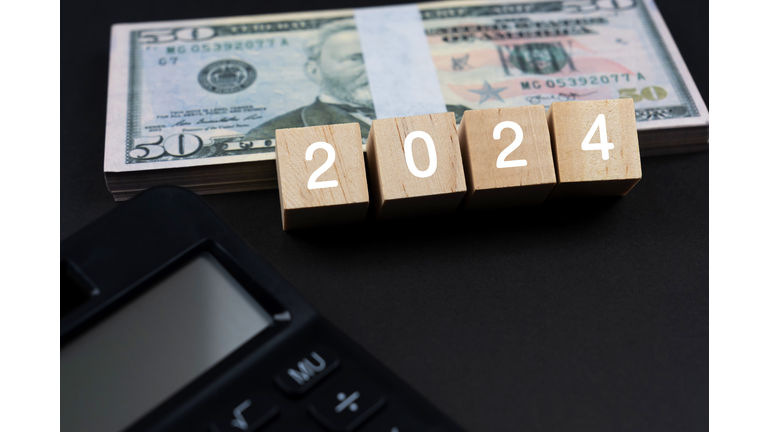 New Year 2024 Concept with Paper Money and Calculator