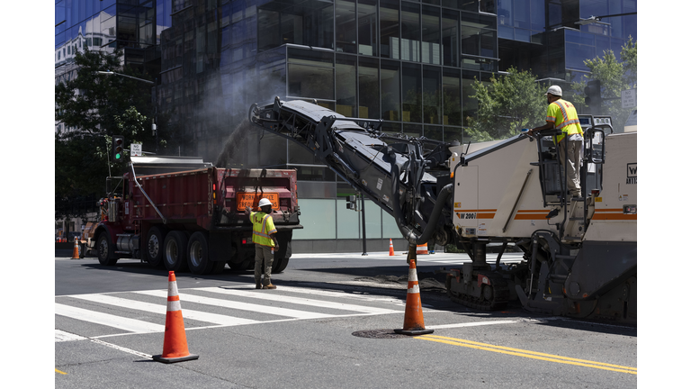 Workers Repave Roadways In Washington, DC