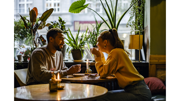 Couple on a weekend date at cute cafe