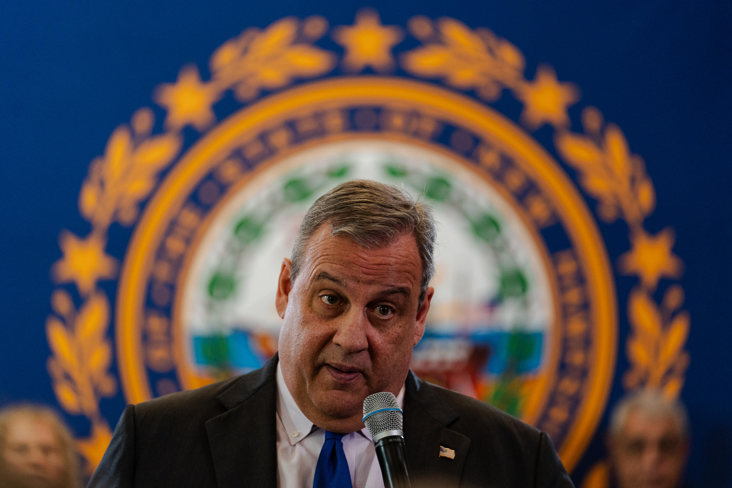 Chris Christie Exits 2024 GOP Presidential Race After Hot Mic Slip | IHeart