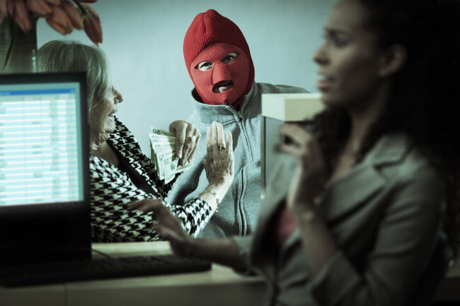 Robber with Teller and Customer in Retail Bank Window