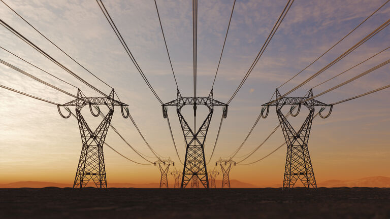 High Voltage Electric Power Lines At Sunset