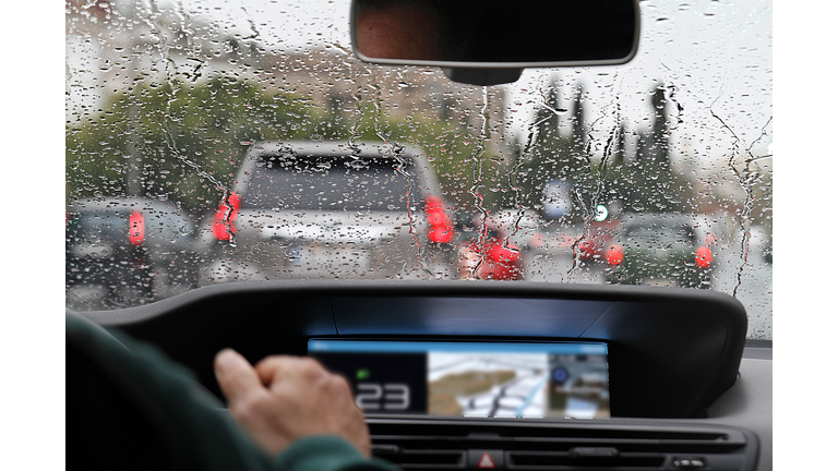 View from car with rain drops of traffic jam in the street